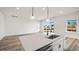 Modern kitchen island with a sink, stainless steel dishwasher, and views of the outside at 143 Summerwind Dr, Summerville, SC 29486