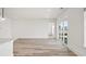 Spacious living room featuring light wood floors and sliding glass doors at 143 Summerwind Dr, Summerville, SC 29486