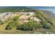 Aerial view of community development, showing new homes and undeveloped land at 1639 Cultivation Ln # 449, Mount Pleasant, SC 29466