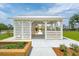 White wooden community gazebo with metal roof and seating at 1639 Cultivation Ln # 449, Mount Pleasant, SC 29466