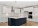 Modern kitchen island with white quartz countertop and dark lower cabinets at 1639 Cultivation Ln # 449, Mount Pleasant, SC 29466