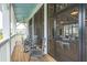 Screened porch with rocking chairs overlooking the community at 1639 Cultivation Ln # 449, Mount Pleasant, SC 29466