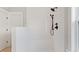 Walk-in shower with white tile and black accents at 1639 Cultivation Ln # 449, Mount Pleasant, SC 29466
