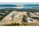 Aerial view of new home community under construction with pond and clubhouse at 1686 Cultivation Ln # 544, Mount Pleasant, SC 29466