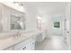 Luxurious bathroom with double vanity, quartz countertops and a large mirror at 1686 Cultivation Ln # 544, Mount Pleasant, SC 29466