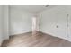 Bright bedroom with hardwood floors and an open door to another room at 1686 Cultivation Ln # 544, Mount Pleasant, SC 29466