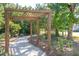 Wooden pergola with bench creates a tranquil seating area on nature trail at 1686 Cultivation Ln # 544, Mount Pleasant, SC 29466