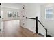 Hardwood floor hallway leading to bedrooms and a staircase at 1686 Cultivation Ln # 544, Mount Pleasant, SC 29466