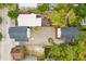 This aerial view shows a home with a dark roof and a spacious backyard and deck area at 72 Drake St # A, Charleston, SC 29403