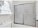 Bathroom with shower/tub combo and frosted glass enclosure at 13 Charlyn Dr, Charleston, SC 29407