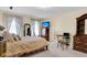 Bedroom with wooden furniture, neutral color palette and a workspace at 13 Charlyn Dr, Charleston, SC 29407