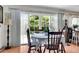 Bright dining area with table and chairs, featuring sliding glass doors leading to backyard at 13 Charlyn Dr, Charleston, SC 29407