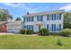 Two-story house with blue shutters, attached garage, and green lawn at 13 Charlyn Dr, Charleston, SC 29407