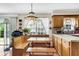 Cozy kitchen with wood cabinets, built-in bench seating, and modern appliances at 13 Charlyn Dr, Charleston, SC 29407