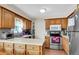 Galley kitchen with ample wood cabinetry and stainless steel appliances at 13 Charlyn Dr, Charleston, SC 29407