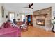 Living room featuring a fireplace, hardwood floors, and a comfy sofa at 13 Charlyn Dr, Charleston, SC 29407