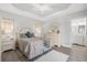 Bright bedroom boasts tray ceilings, recessed lighting, and neutral paint creating a serene atmosphere at 8272 Palmetto Rd, Edisto Island, SC 29438