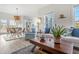 Bright living room with connecting dining and kitchen area, blending style and functionality at 8272 Palmetto Rd, Edisto Island, SC 29438