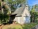 Exterior view of a detached garage/outbuilding, providing extra storage space or workshop area at 8272 Palmetto Rd, Edisto Island, SC 29438