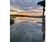 Stunning sunset view with calm waters reflecting the colorful sky near the home's dock at 8272 Palmetto Rd, Edisto Island, SC 29438