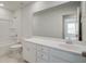 Bright bathroom with white vanity, bathtub, and shower at 1892 Nola Run Run, Summerville, SC 29485