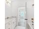 Well-lit bathroom with tub-shower combo, white cabinets, marble counters, and bronze fixtures at 450 Ripple Park Dr, Summerville, SC 29486