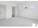Bright bedroom with neutral carpet, white trim, and two doors at 450 Ripple Park Dr, Summerville, SC 29486