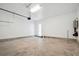 Spacious garage with neutral colors, concrete floor, and a doorway leading to the interior at 450 Ripple Park Dr, Summerville, SC 29486