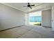 A covered patio with recessed lighting, ceiling fan, concrete floor, and gray wood-look siding at 450 Ripple Park Dr, Summerville, SC 29486