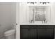 Bathroom featuring double sinks, a large mirror, and a visible shower at 133 Summerwind Dr, Summerville, SC 29486
