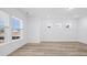 Large bedroom with laminate floors, neutral paint, and bright windows at 133 Summerwind Dr, Summerville, SC 29486