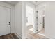 Inviting hallway features clean lines, light wood floors, and access to a bedroom and bathroom at 133 Summerwind Dr, Summerville, SC 29486