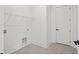 This utility room has tile floors, white walls, and a door at 133 Summerwind Dr, Summerville, SC 29486