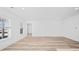 A bright living room boasts wood-look flooring, ample natural light, and a neutral color palette at 133 Summerwind Dr, Summerville, SC 29486