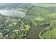 Beautiful aerial view of a lake community nestled within a vibrant green forest at 1713 Pimlico Blvd, Moncks Corner, SC 29461