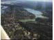 Aerial view of lake community surrounded by lush green forests at 1713 Pimlico Blvd, Moncks Corner, SC 29461