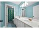 Bathroom boasts double sinks, a shower, and a stylish mirror at 1713 Pimlico Blvd, Moncks Corner, SC 29461