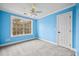 Blue bedroom with grey carpet and ceiling fan at 1713 Pimlico Blvd, Moncks Corner, SC 29461