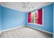 Blue bedroom with grey carpet and ceiling fan at 1713 Pimlico Blvd, Moncks Corner, SC 29461