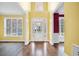 Bright entryway with hardwood floors and view to living room and stairs at 1713 Pimlico Blvd, Moncks Corner, SC 29461