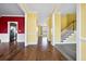 Bright entryway with hardwood floors and view to kitchen and stairs at 1713 Pimlico Blvd, Moncks Corner, SC 29461
