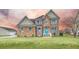 Two-story house with stone accents and a teal front door at 1713 Pimlico Blvd, Moncks Corner, SC 29461