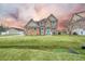 Two-story house with stone accents and a teal front door, wide angle at 1713 Pimlico Blvd, Moncks Corner, SC 29461