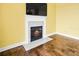 Modern fireplace with marble surround in a yellow room at 1713 Pimlico Blvd, Moncks Corner, SC 29461