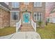 Teal front door with white railings and brick steps at 1713 Pimlico Blvd, Moncks Corner, SC 29461
