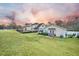 House exterior with a detached garage and patio area at 1713 Pimlico Blvd, Moncks Corner, SC 29461