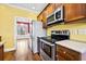 Kitchen with stainless steel appliances and wood cabinets at 1713 Pimlico Blvd, Moncks Corner, SC 29461