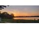Stunning sunset view over the tranquil lake at 1713 Pimlico Blvd, Moncks Corner, SC 29461