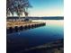 Scenic view of the lake with a wooden dock and clear water reflecting the sky at 1713 Pimlico Blvd, Moncks Corner, SC 29461