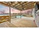 Relaxing pool deck with lake view and covered patio at 1713 Pimlico Blvd, Moncks Corner, SC 29461